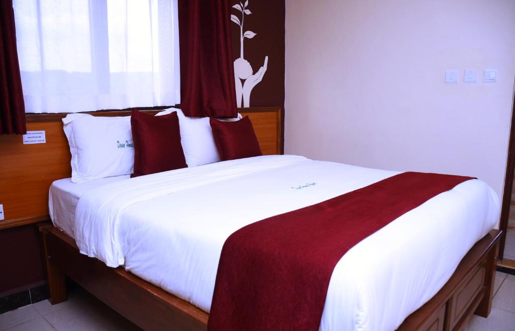 Postel nebo postele na pokoji v ubytování Divine Homes Resort Kisumu
