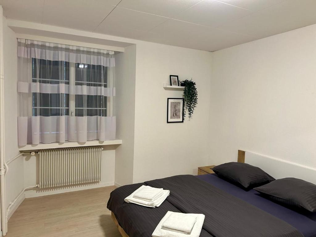 Postel nebo postele na pokoji v ubytování tas24ch Travel and Sleep 24