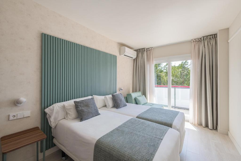 Postel nebo postele na pokoji v ubytování Eurosalou & Spa