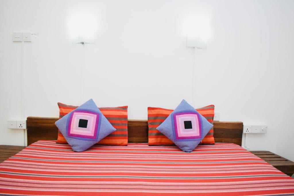 Postel nebo postele na pokoji v ubytování Weaver Bird Villa