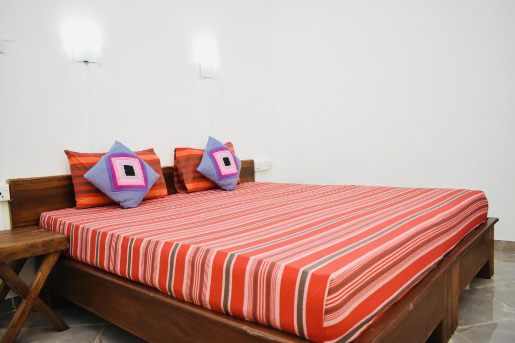 Postel nebo postele na pokoji v ubytování Weaver Bird Villa