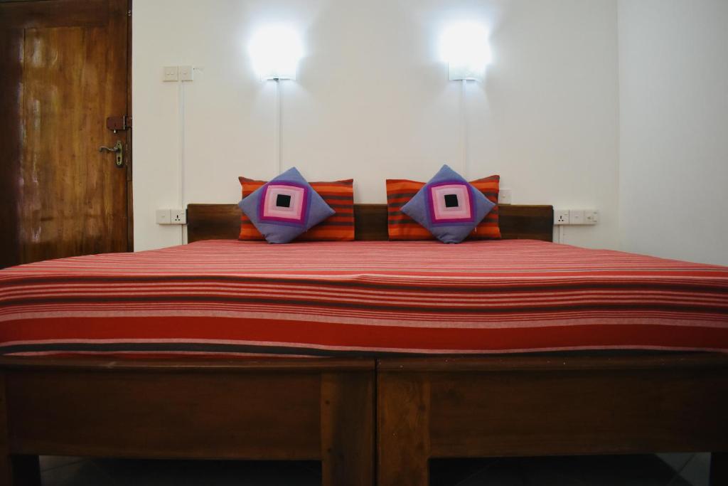 Postel nebo postele na pokoji v ubytování Weaver Bird Villa