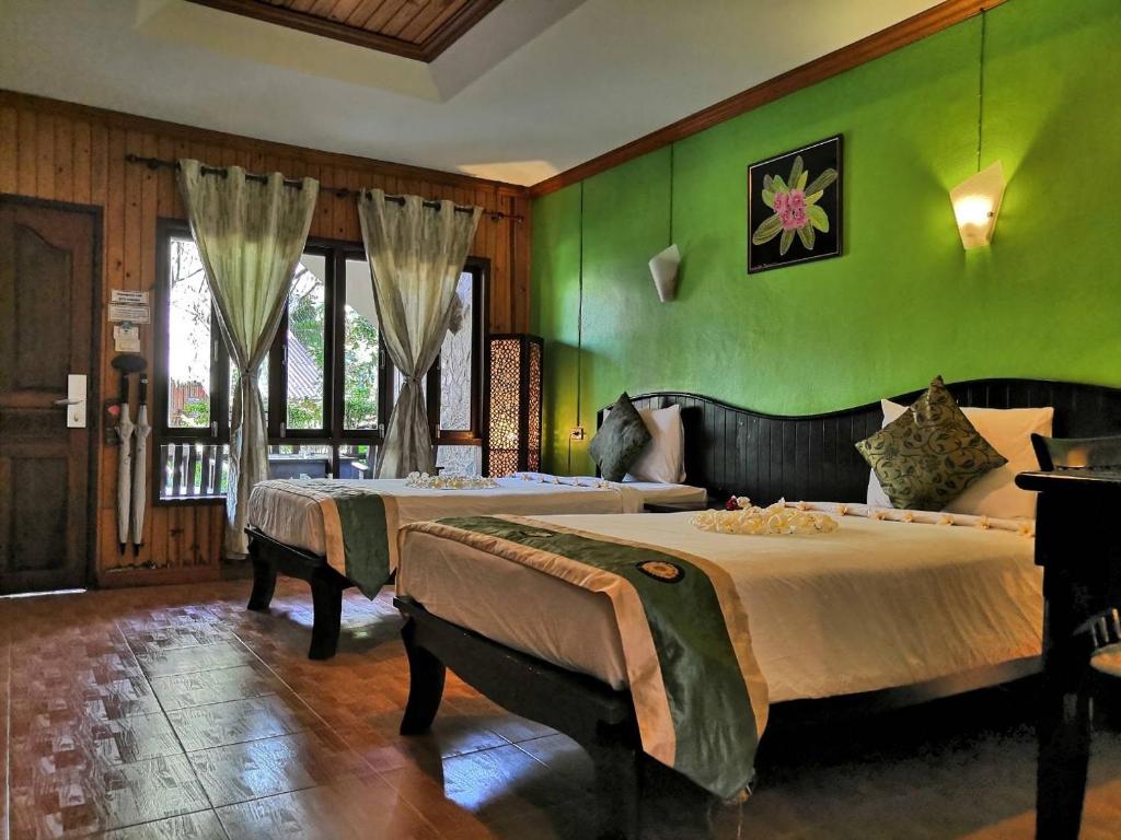 Postel nebo postele na pokoji v ubytování Seashell Resort Koh Tao-SHA Plus
