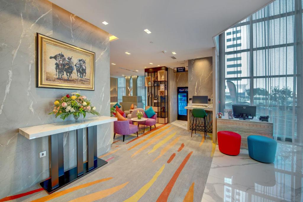 Posezení v ubytování La Quinta by Wyndham Abu Dhabi Al Wahda