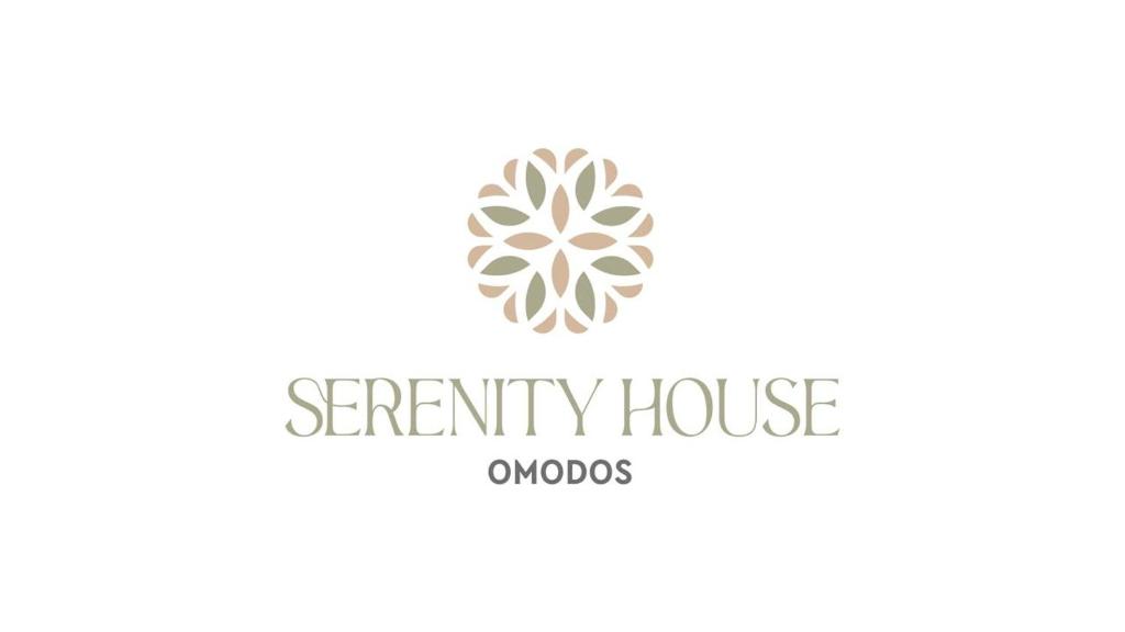 un logo pour une maison à empattements avec une fleur dans l'établissement Omodos Serenity House, à Omodos