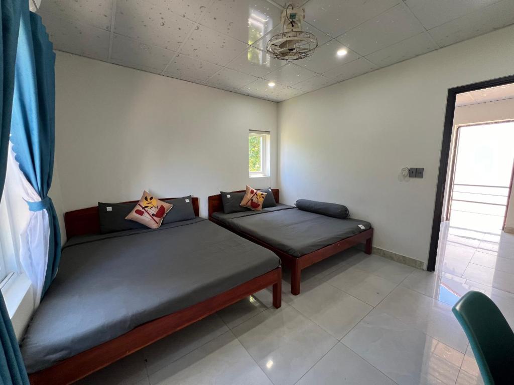 Postel nebo postele na pokoji v ubytování Vườn Gióng Homestay