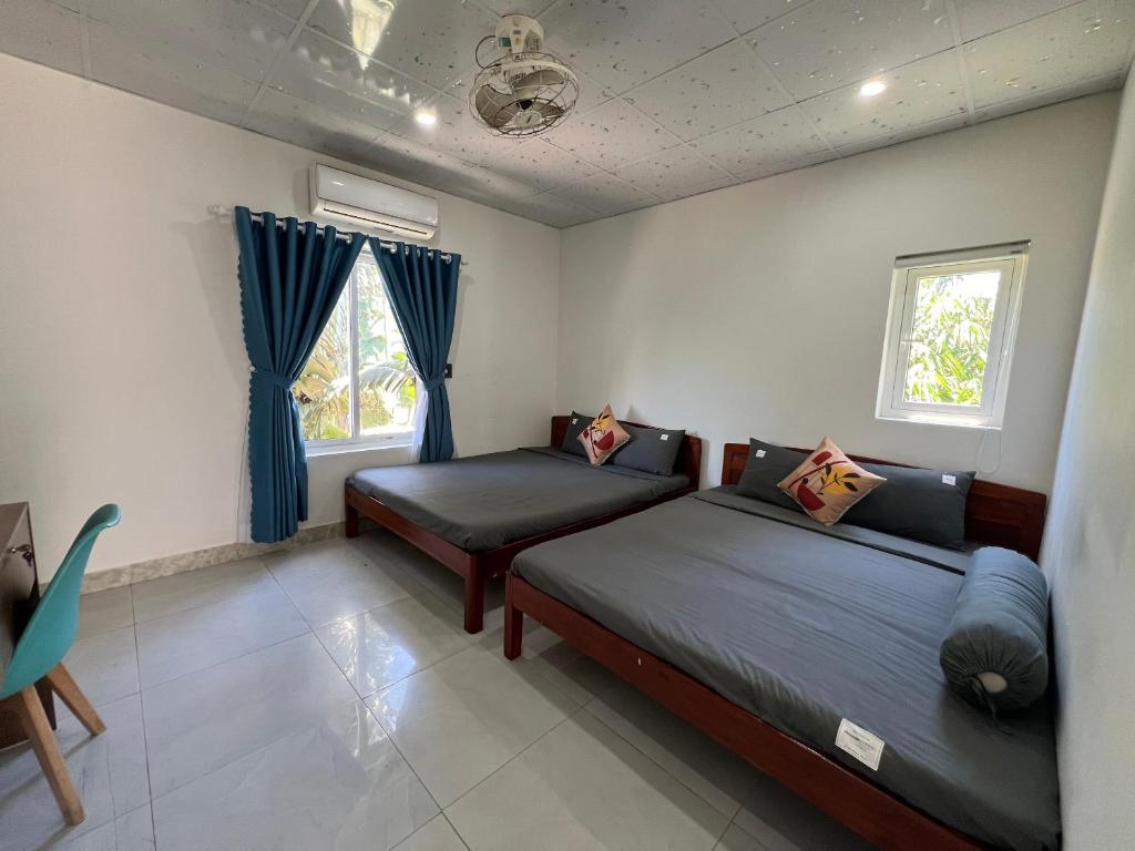 Postel nebo postele na pokoji v ubytování Vườn Gióng Homestay