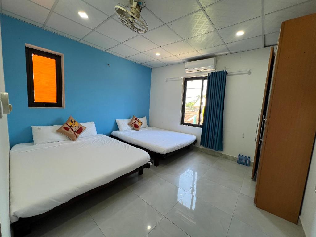 Postel nebo postele na pokoji v ubytování Vườn Gióng Homestay