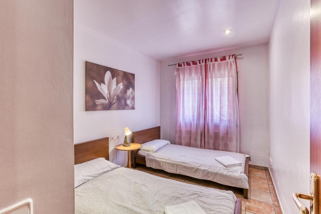 Postel nebo postele na pokoji v ubytování Fantastic Family Villa