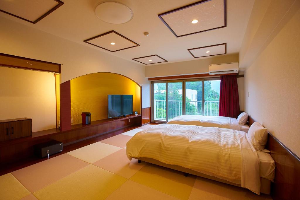 Postel nebo postele na pokoji v ubytování Ooedo Onsen Monogatari Hotel Shinko