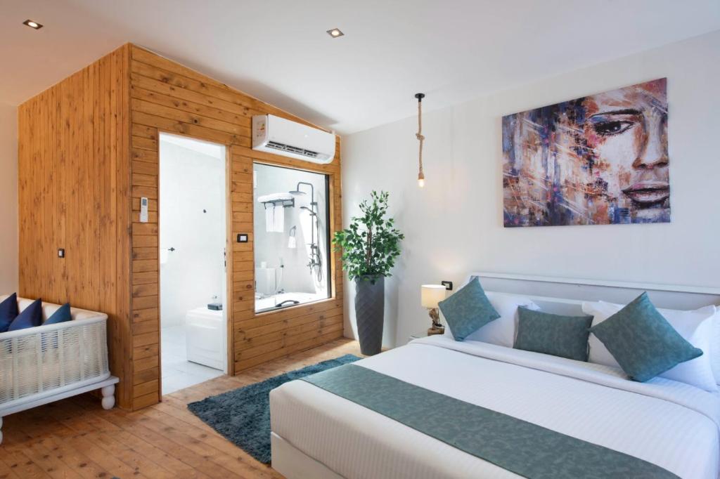 Postel nebo postele na pokoji v ubytování XU Sidi Abdel Rahman Resort & Spa