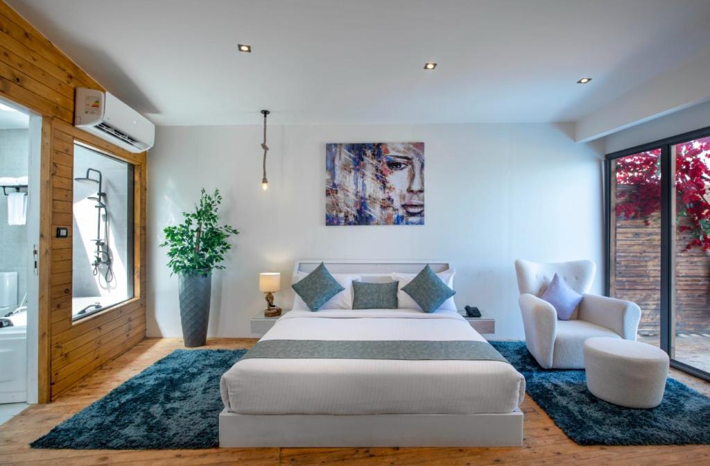Postel nebo postele na pokoji v ubytování XU Sidi Abdel Rahman Resort & Spa