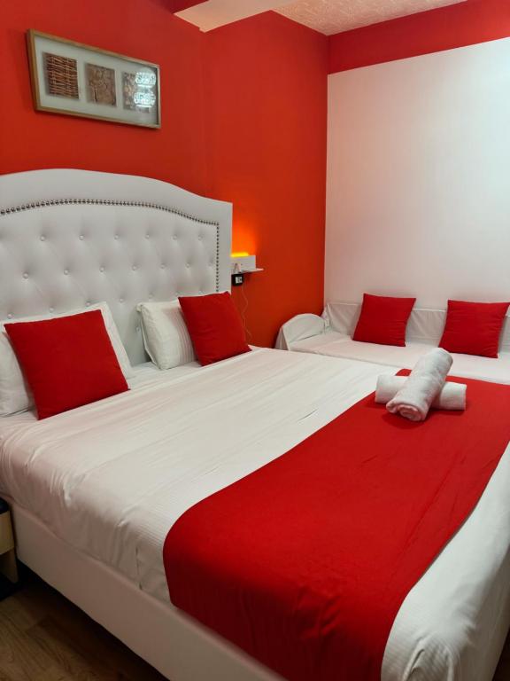 Postel nebo postele na pokoji v ubytování Hotel Veronese