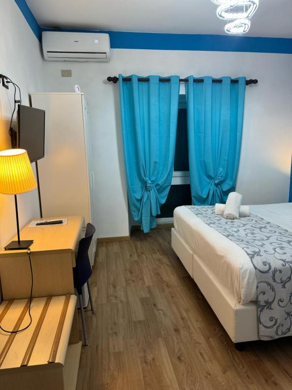 Postel nebo postele na pokoji v ubytování Hotel Veronese