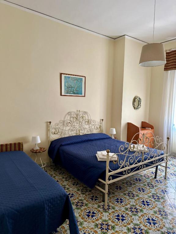 Posteľ alebo postele v izbe v ubytovaní Maman Suite, city center near Molo Beverello