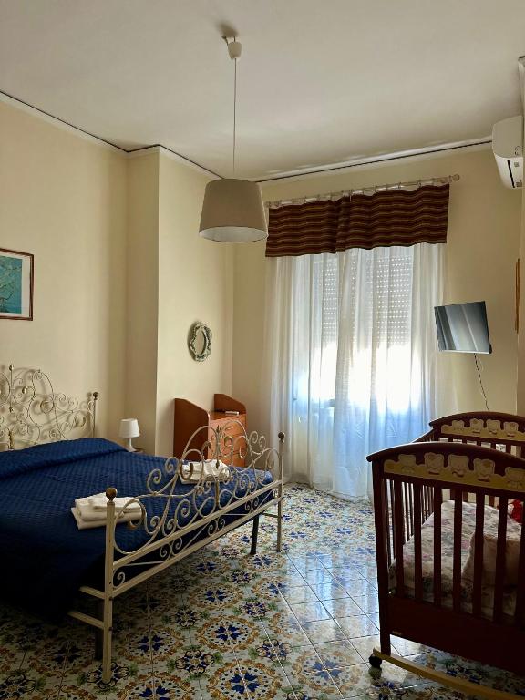 Posteľ alebo postele v izbe v ubytovaní Maman Suite, city center near Molo Beverello