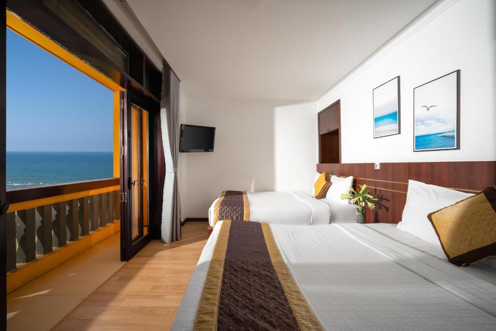 Postel nebo postele na pokoji v ubytování Zenta Sea View Hotel