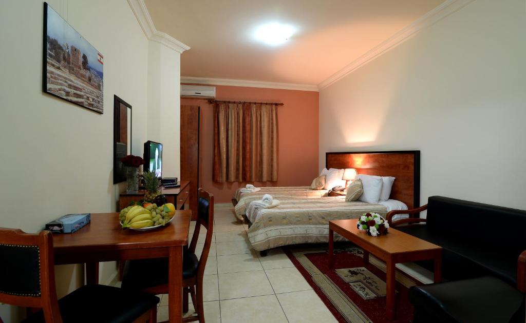 Postel nebo postele na pokoji v ubytování Byblos Comfort Hotel