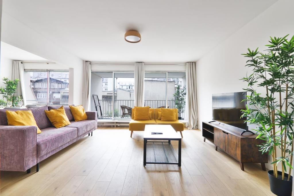 Зона вітальні в Appartement Quartier Canal Saint Martin