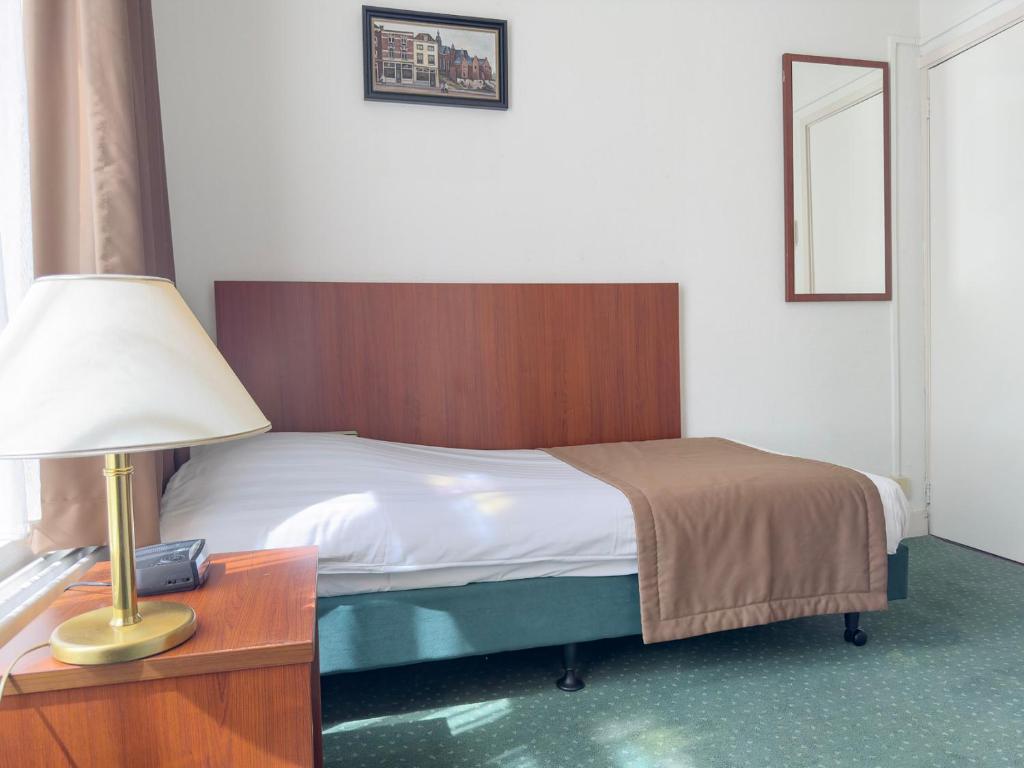 Postel nebo postele na pokoji v ubytování Hotel 't Spijker