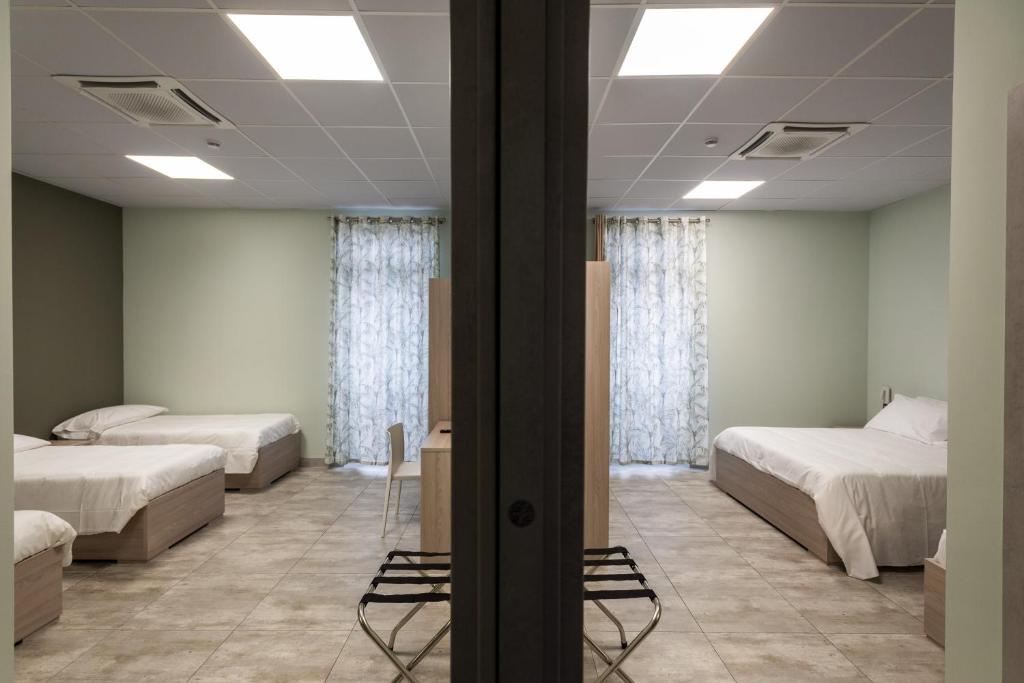 Postel nebo postele na pokoji v ubytování Volpedo hostel