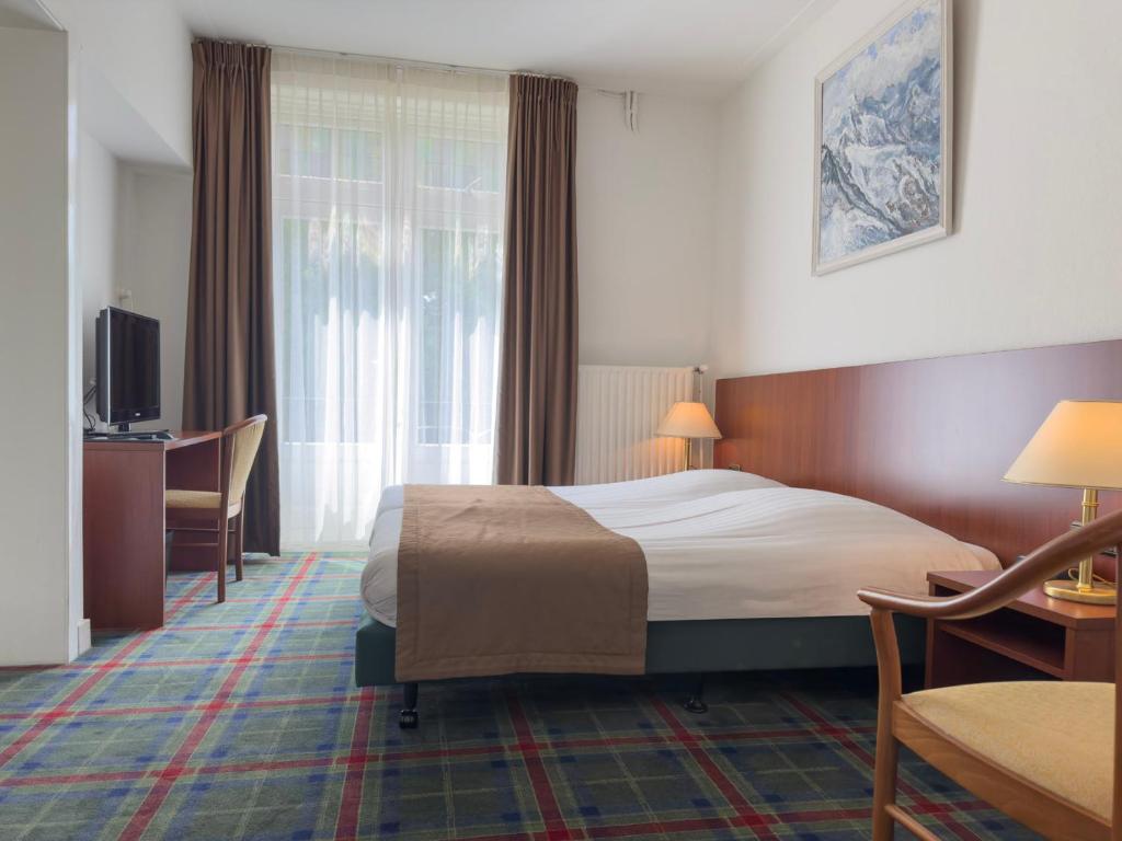 Postel nebo postele na pokoji v ubytování Hotel 't Spijker