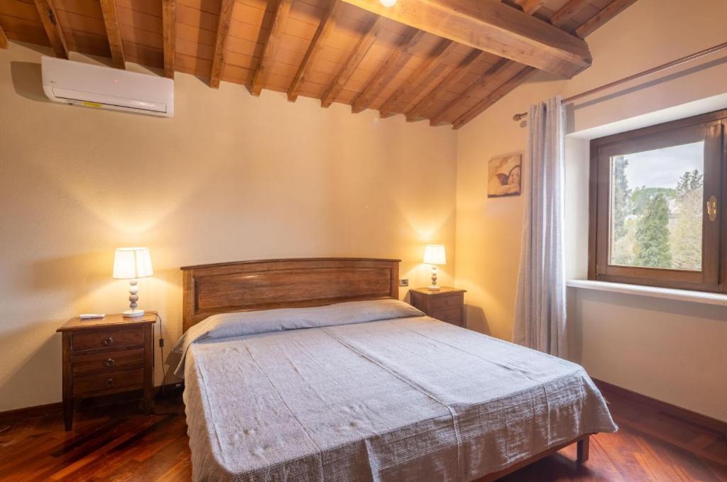 Postel nebo postele na pokoji v ubytování Villa La Fornace - Campagnatico, Italy