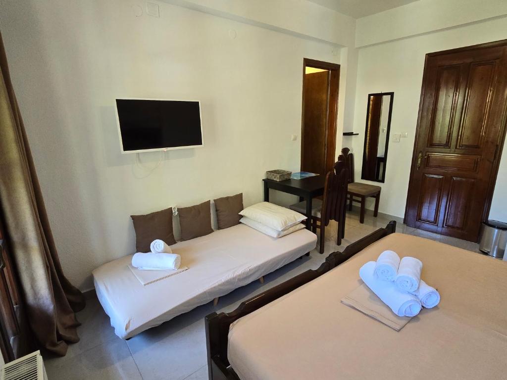 Postel nebo postele na pokoji v ubytování Karidia Apartments