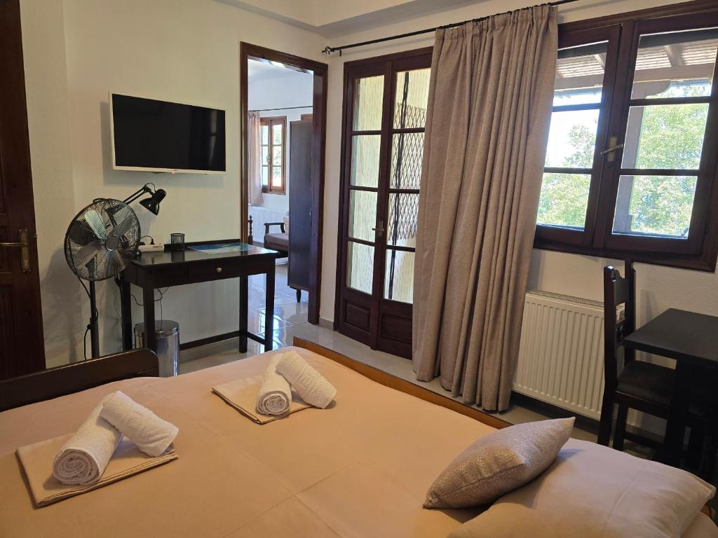 Postel nebo postele na pokoji v ubytování Karidia Apartments