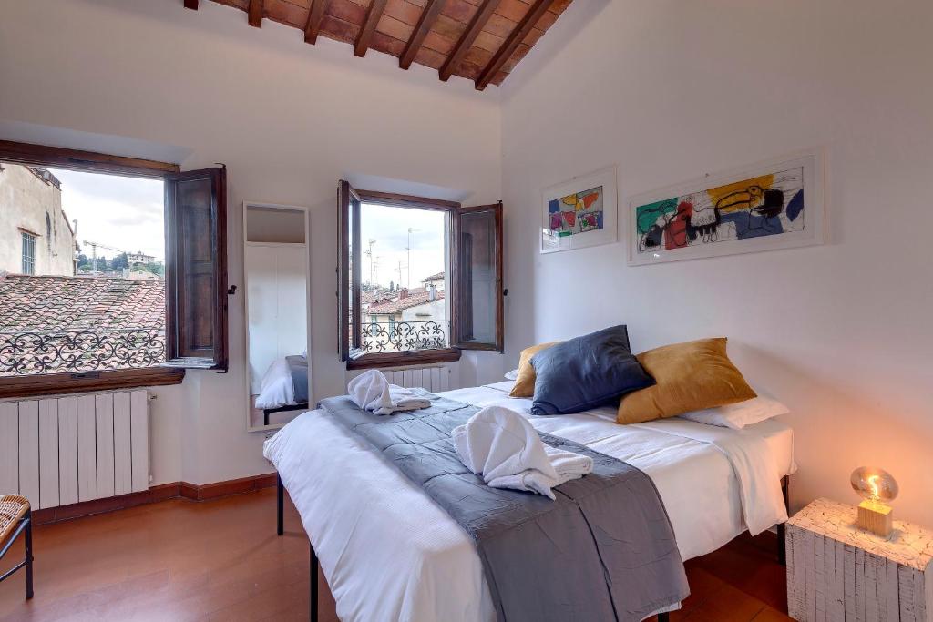 Posteľ alebo postele v izbe v ubytovaní Opera - Sinfonia - Minuetto - Melody Apartments by Mamo Florence