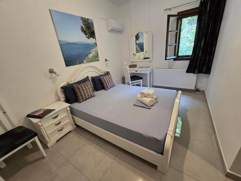 Postel nebo postele na pokoji v ubytování Karidia Apartments