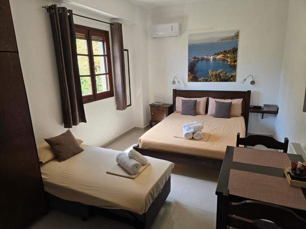 Postel nebo postele na pokoji v ubytování Karidia Apartments