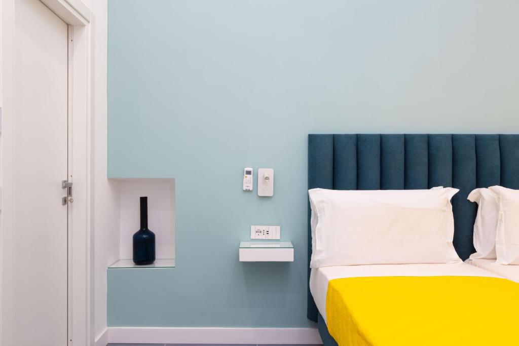 Postel nebo postele na pokoji v ubytování Maison Rosetta