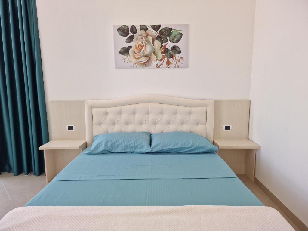 Postel nebo postele na pokoji v ubytování Erald Guest House
