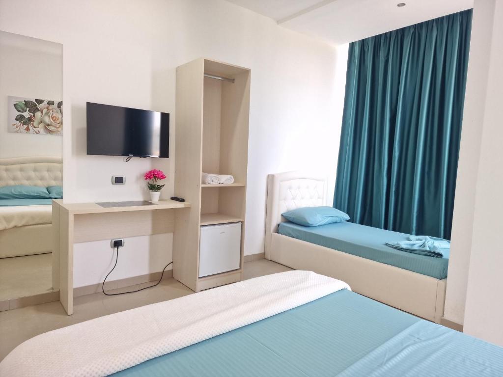 Postel nebo postele na pokoji v ubytování Erald Guest House