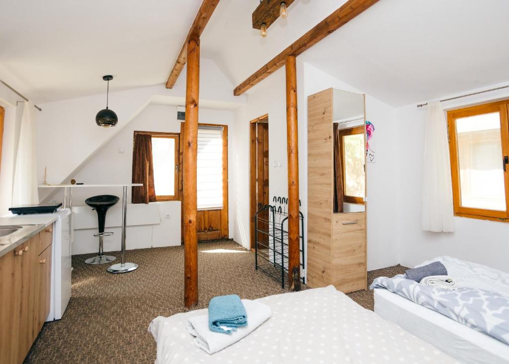 Postel nebo postele na pokoji v ubytování ARK Village Liberland