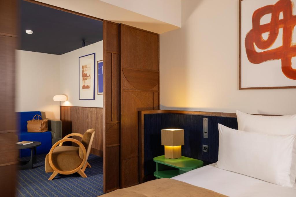 Postel nebo postele na pokoji v ubytování Hôtel Gabbie