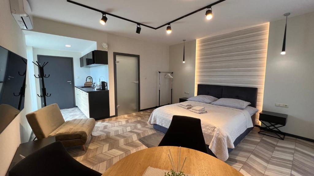 Posteľ alebo postele v izbe v ubytovaní BUNASTA Apartments