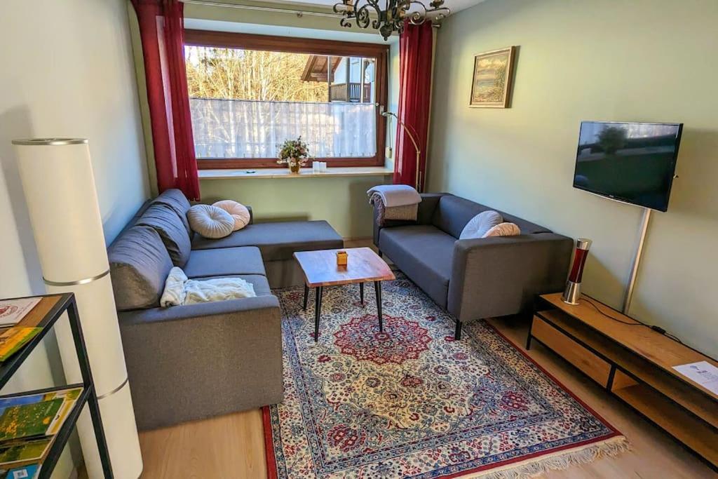 Posezení v ubytování Ferienwohnung mit Garten und Bergblick