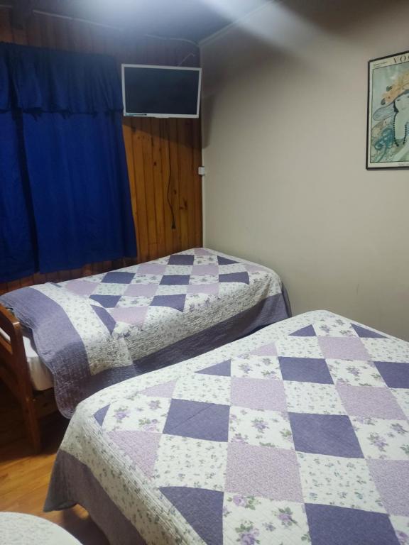 Postel nebo postele na pokoji v ubytování Hostal Saint Michell. El Quisco