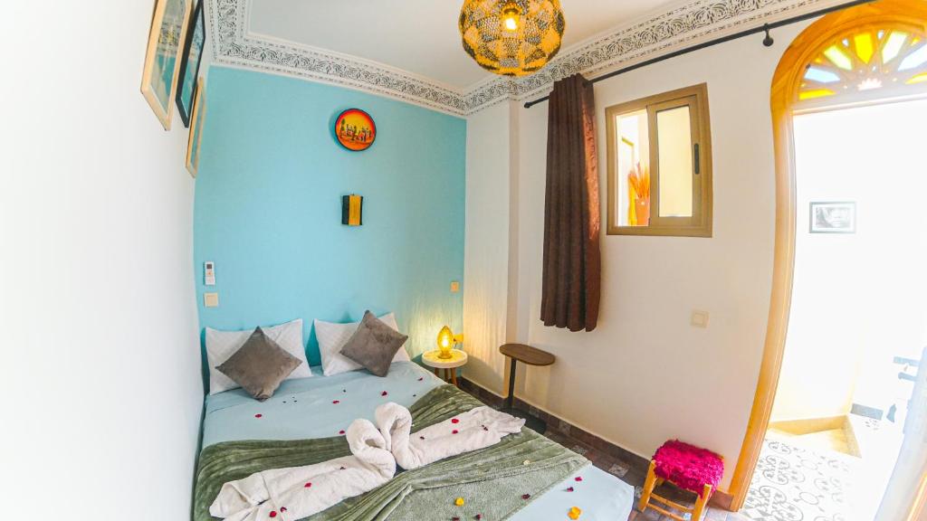 Postel nebo postele na pokoji v ubytování Riad Dar Yassine