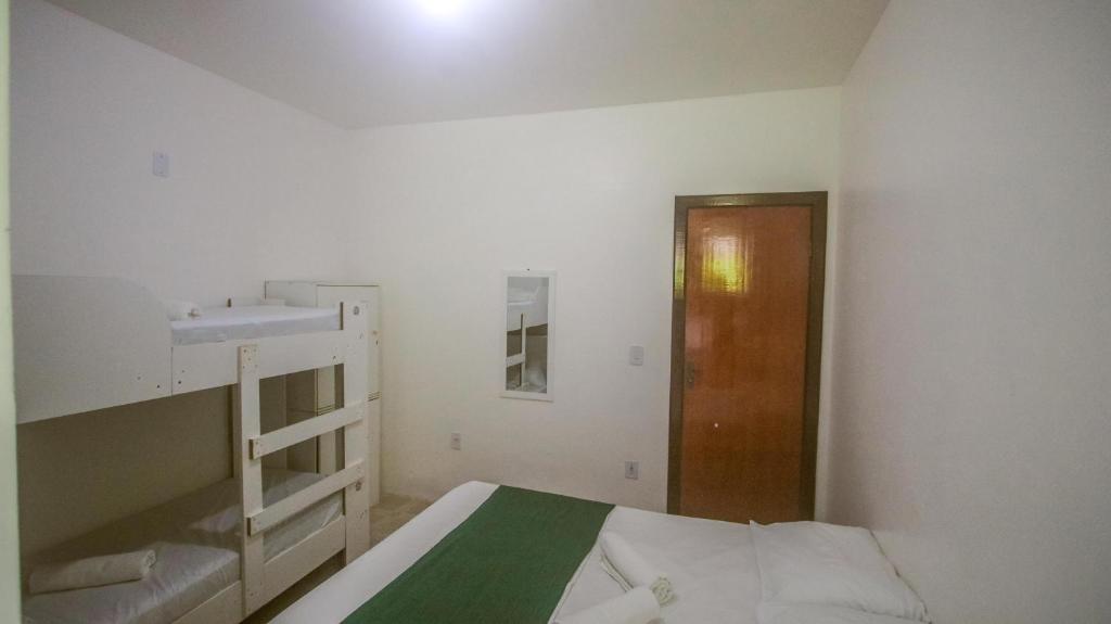 Postel nebo postele na pokoji v ubytování Sky Suites Pousada