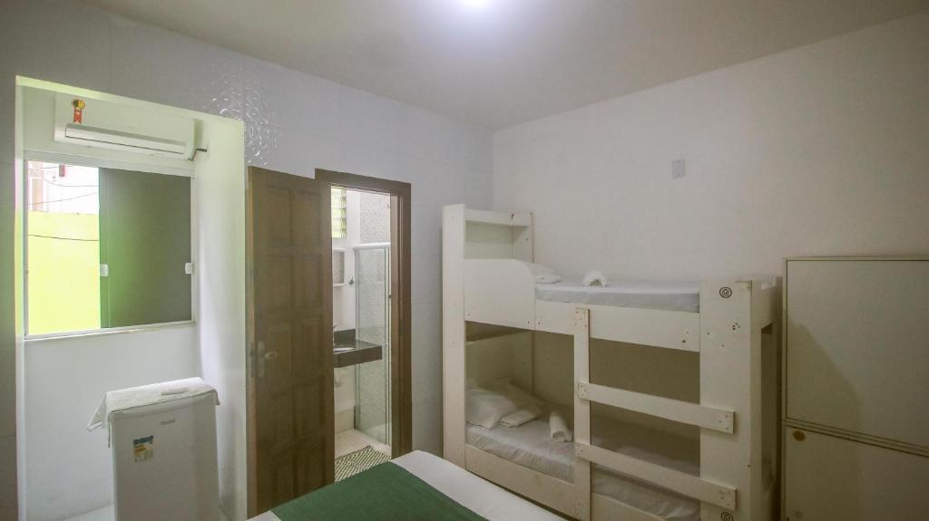 Postel nebo postele na pokoji v ubytování Sky Suites Pousada