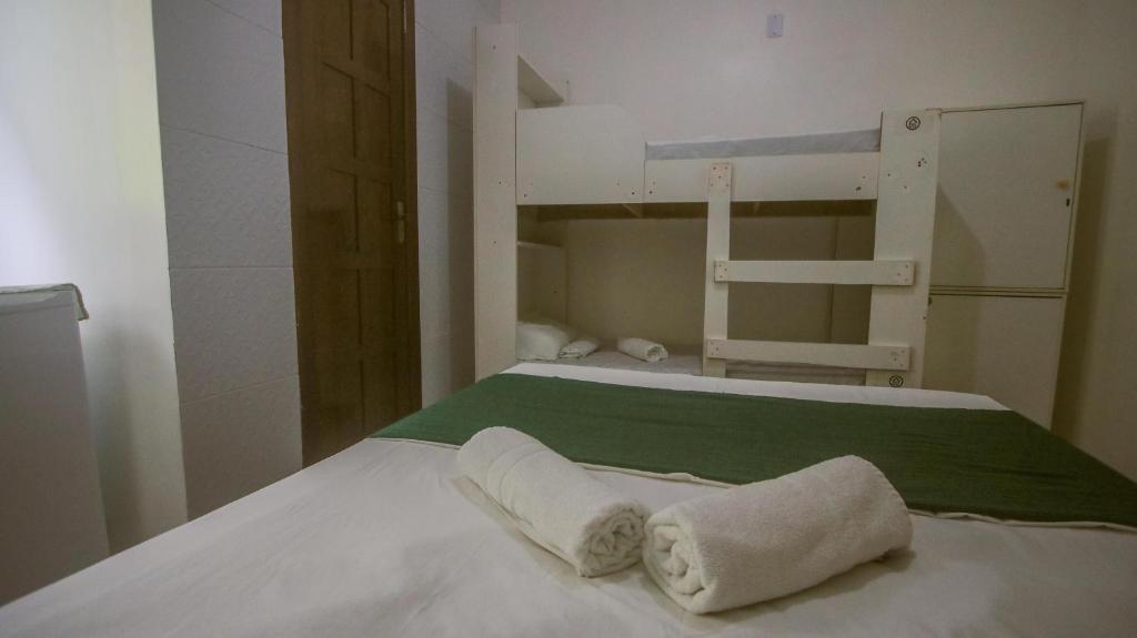 Postel nebo postele na pokoji v ubytování Sky Suites Pousada