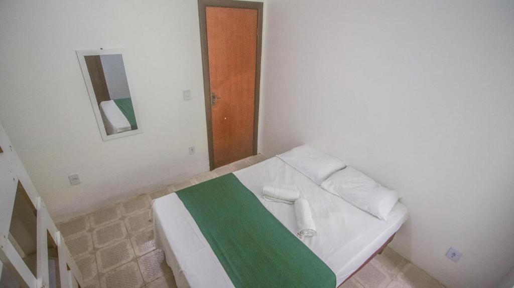 Postel nebo postele na pokoji v ubytování Sky Suites Pousada
