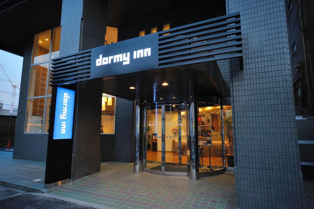 a store front of a building with a sign on it at Dormy Inn Chiba City Soga in Chiba