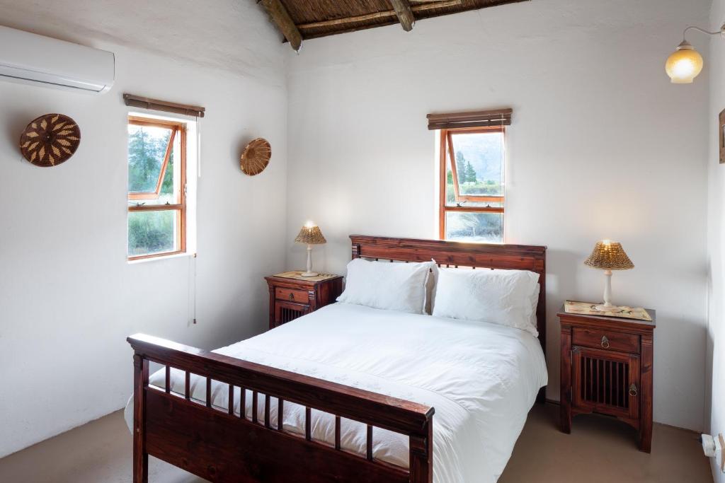 Postel nebo postele na pokoji v ubytování Alpha Excelsior Guest Farm