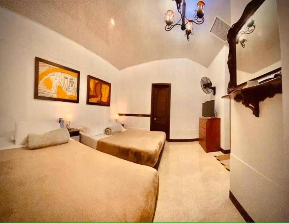 Giường trong phòng chung tại Hospedaje Camino Real a 150 MTS del centro