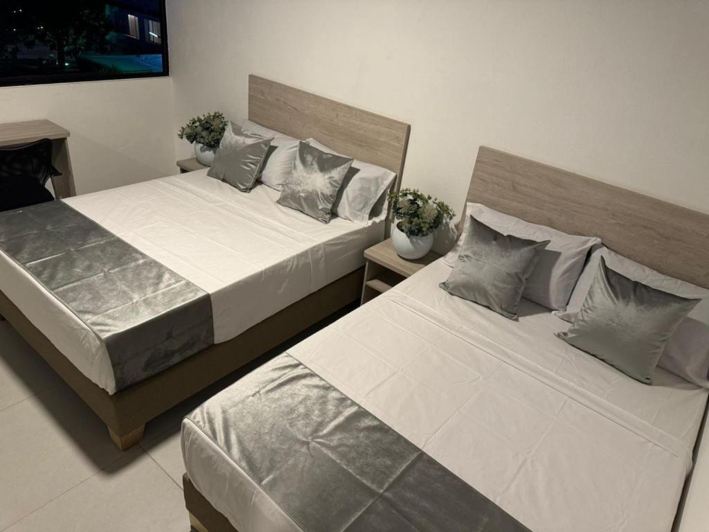 Postel nebo postele na pokoji v ubytování Hotel Med Llanogrande