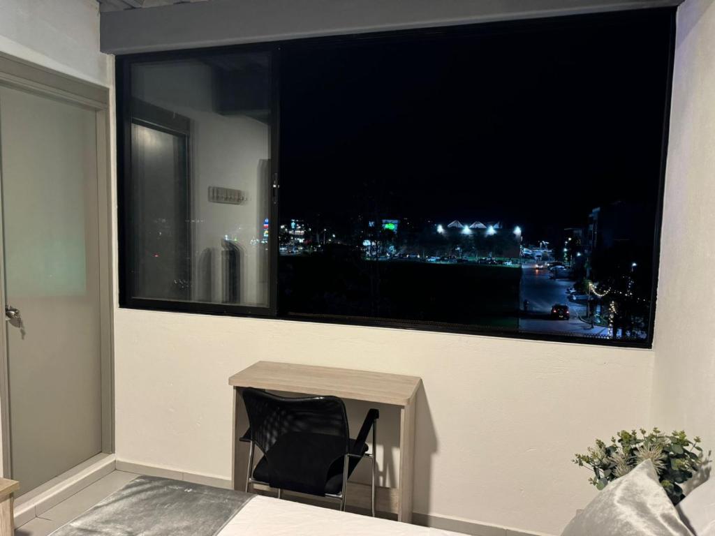 TV a/nebo společenská místnost v ubytování Hotel Med Llanogrande